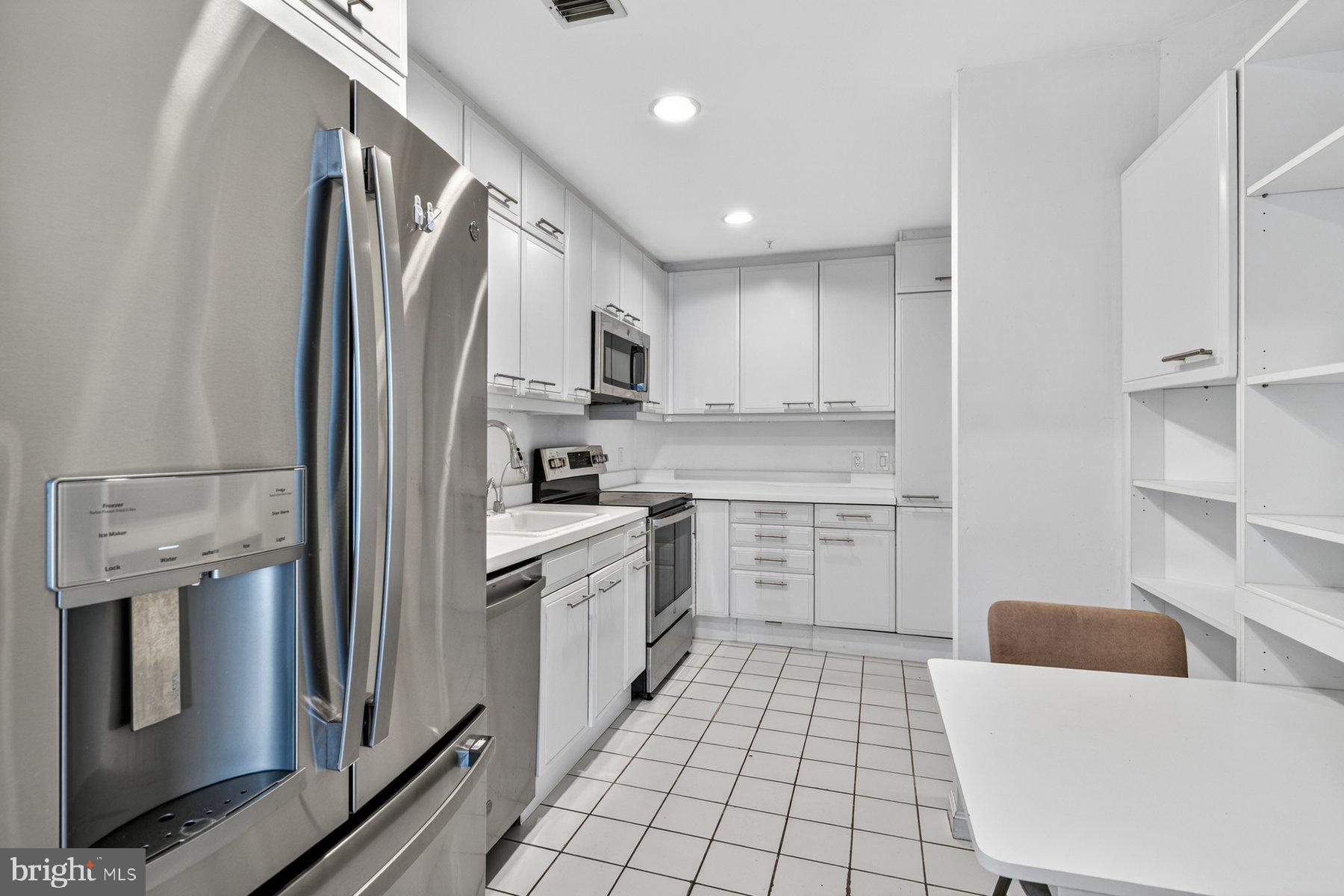 3801 Canterbury Road, Unit 403 Baltimore, MD 21218 - Photo 4 of 25 Sleek modern kitchen with ample storage.