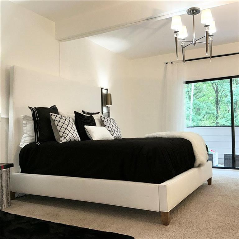 3823 Paces Ferry West Atlanta, GA 30339 - Photo 16 of 33 a bedroom with a bed and window