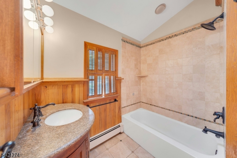 95 Wildwood Road Oak Ridge, NJ 07438 - Photo 12 of 36 a bathroom with a granite countertop sink toilet and shower