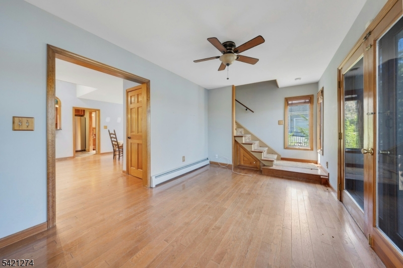 95 Wildwood Road Oak Ridge, NJ 07438 - Photo 13 of 36 a view of a hallway with wooden floor and entryway
