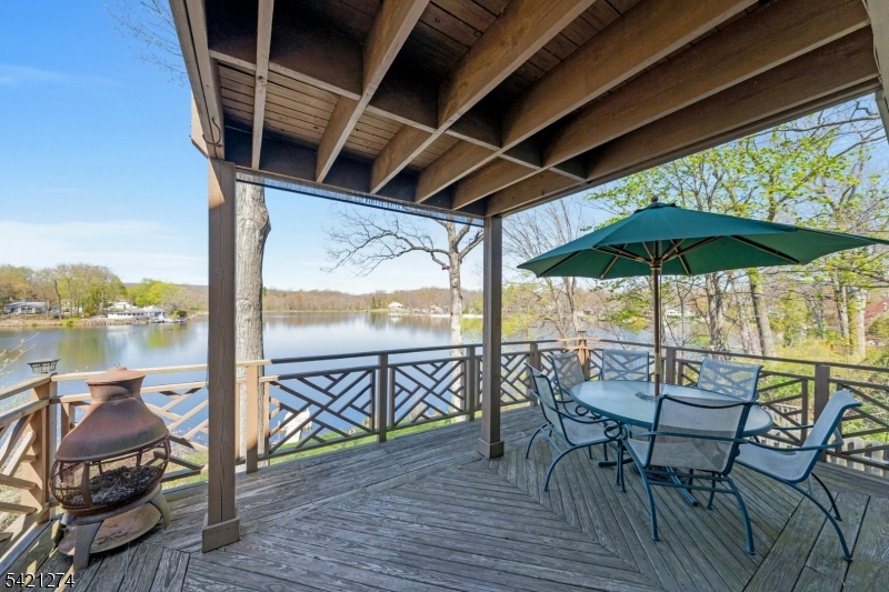 95 Wildwood Road Oak Ridge, NJ 07438 - Photo 15 of 36 a view of chairs and table in the balcony