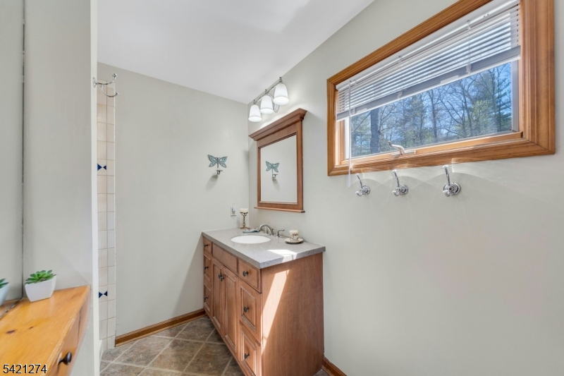 95 Wildwood Road Oak Ridge, NJ 07438 - Photo 23 of 36 a utility room with a window dryer and washer