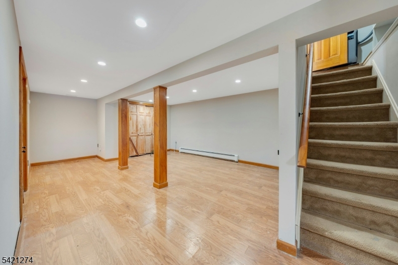 95 Wildwood Road Oak Ridge, NJ 07438 - Photo 25 of 36 a view of an empty room with stairs