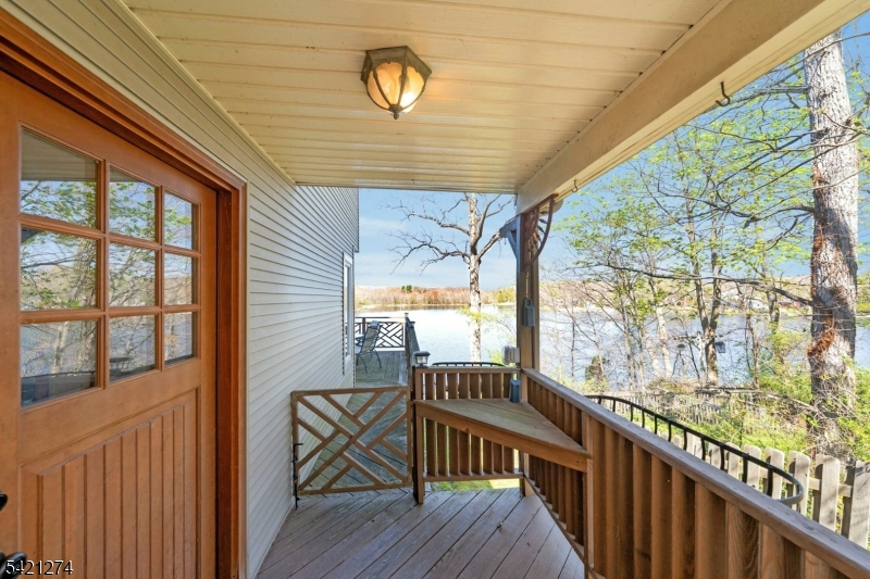 95 Wildwood Road Oak Ridge, NJ 07438 - Photo 4 of 36 a view of balcony with wooden floor
