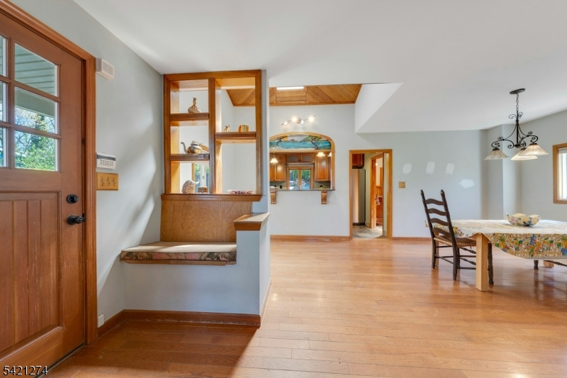 95 Wildwood Road Oak Ridge, NJ 07438 - Photo 5 of 36 a view of a livingroom with furniture window and wooden floor