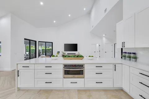 a room with a bed and a flat screen tv