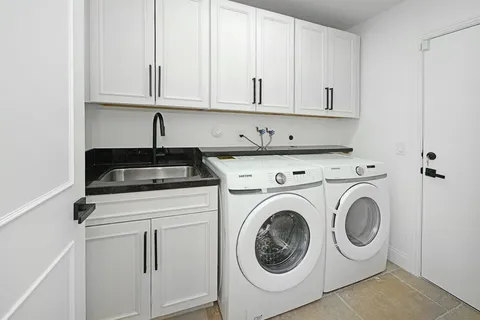 a bathroom with a sink a toilet and a shower curtain