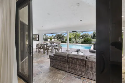 a spacious bedroom with a bed and a flat screen tv