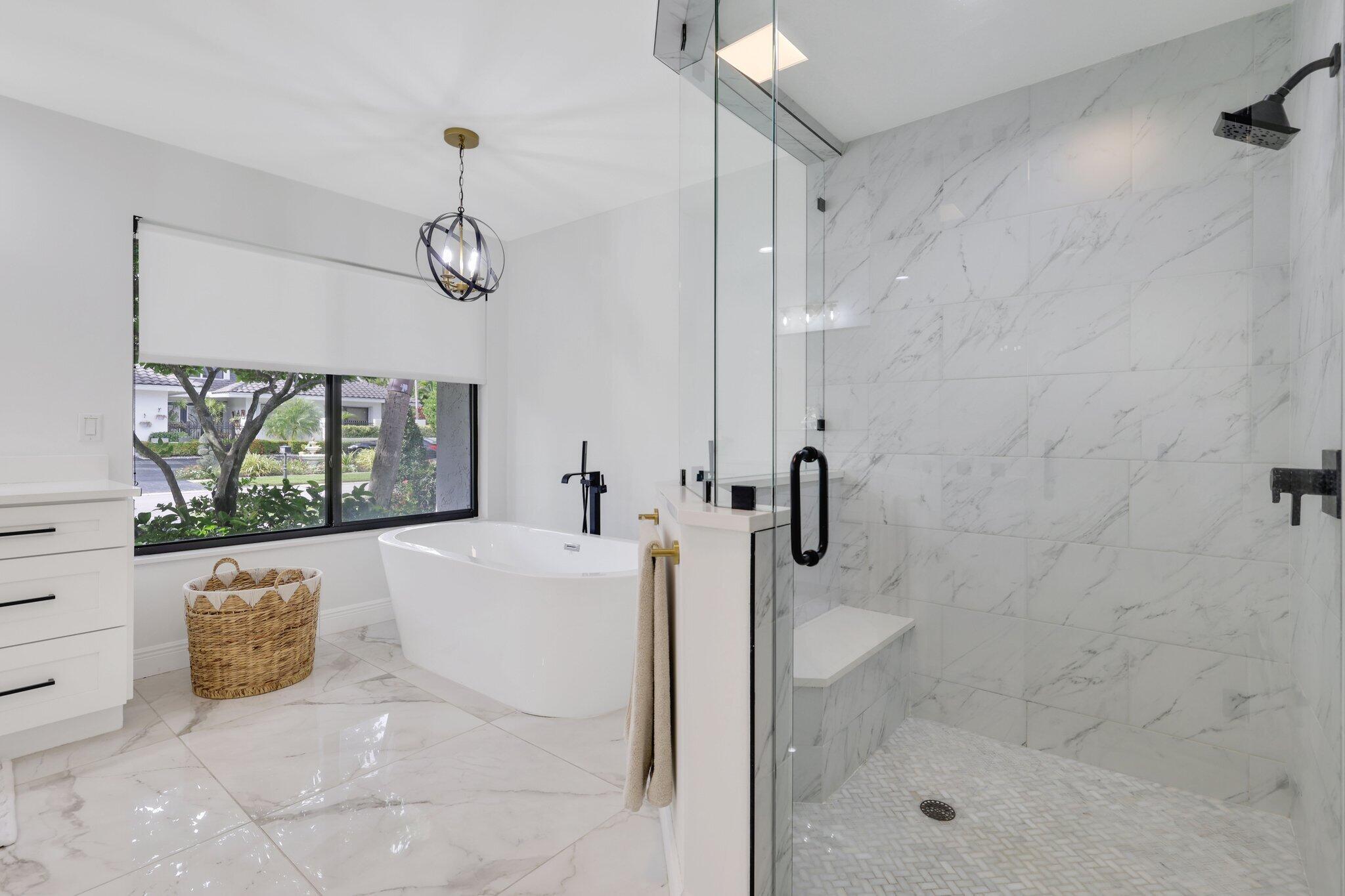 7811 Mandarin Drive Boca Raton, FL 33433 - Photo 27 of 51 a bathroom with a bathtub and a shower