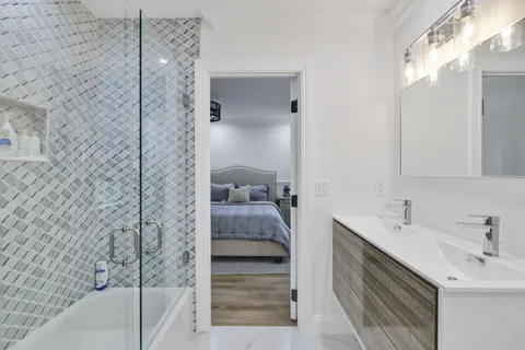 a bathroom with a sink and a mirror
