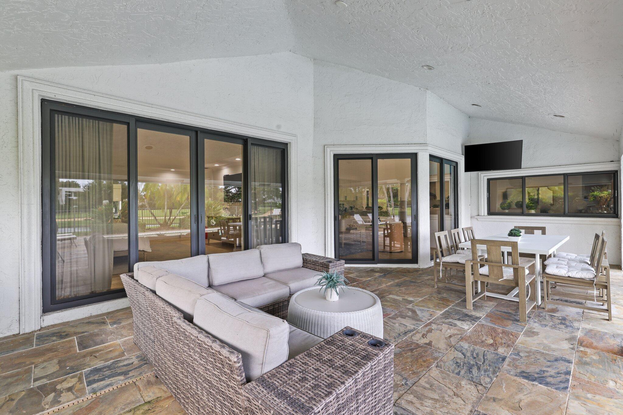 7811 Mandarin Drive Boca Raton, FL 33433 - Photo 45 of 51 a living room with furniture and large windows