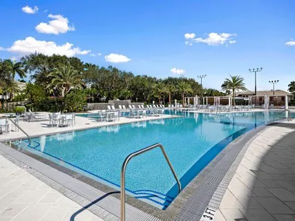 a view of a swimming pool with a table and chairs