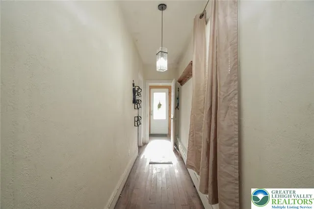 a kitchen with stainless steel appliances granite countertop a stove and white cabinets