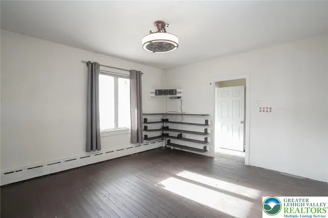 a bathroom with a toilet sink and shower