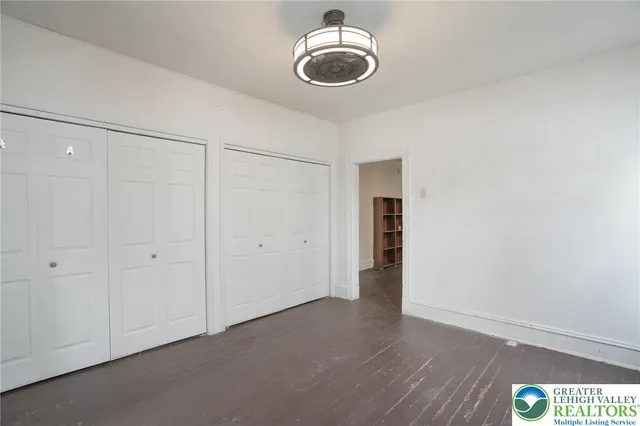 a bathroom with a sink and mirror with toilet