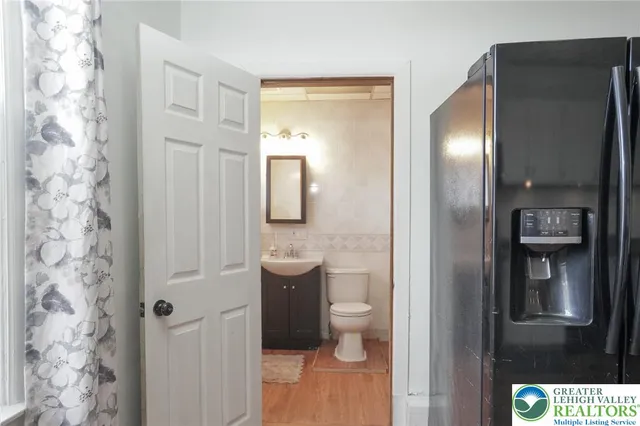 a view of a balcony with a door and a chair