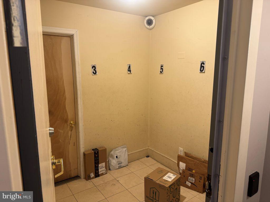 1245 13th Street Northwest, Unit 313 Washington, DC 20005 - Photo 27 of 33 Secured package pick-up room (front Entry foyer)