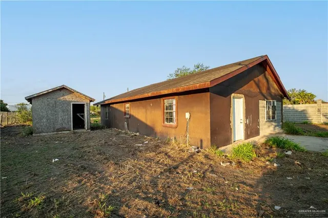 a backyard of a house with large trees