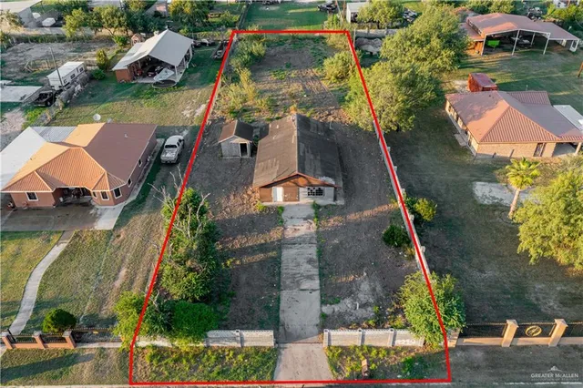 an aerial view of residential houses with outdoor space