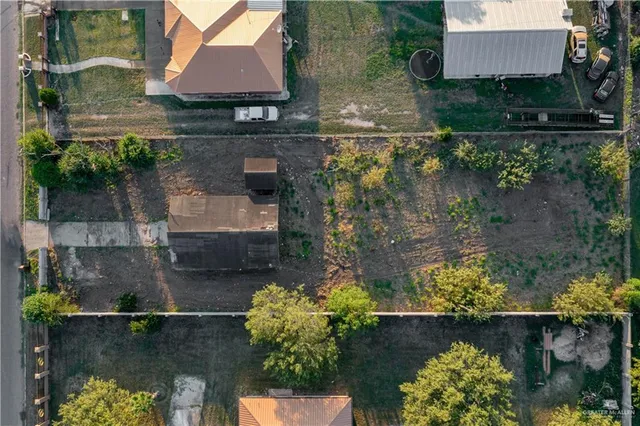 an aerial view of a house with a lake view