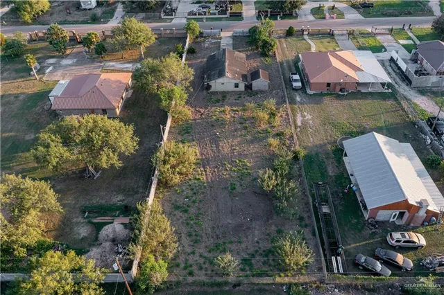 an aerial view of house with yard swimming pool and outdoor seating