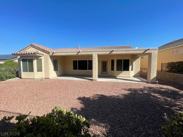 3047 Hickory Valley Road Henderson, NV 89052 - Photo 20 of 21 An inviting covered patio offers outdoor living space in this desert-landscaped backyard.
