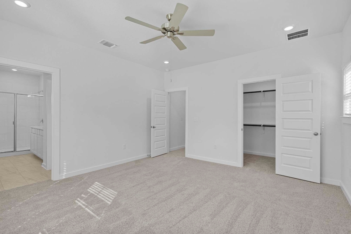 6400 Stockman Drive, Unit 5 Austin, TX 78747 - Photo 13 of 35 a view of an empty room with a ceiling fan