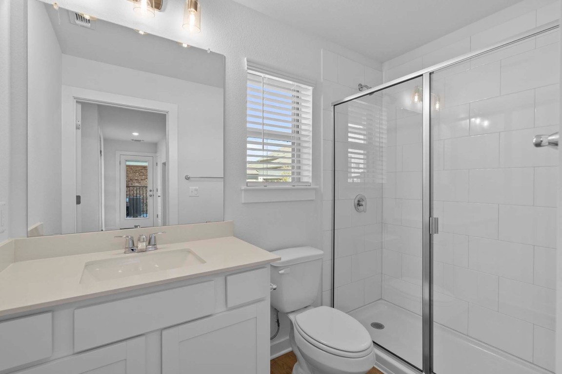 6400 Stockman Drive, Unit 5 Austin, TX 78747 - Photo 20 of 35 a bathroom with a sink a toilet and shower