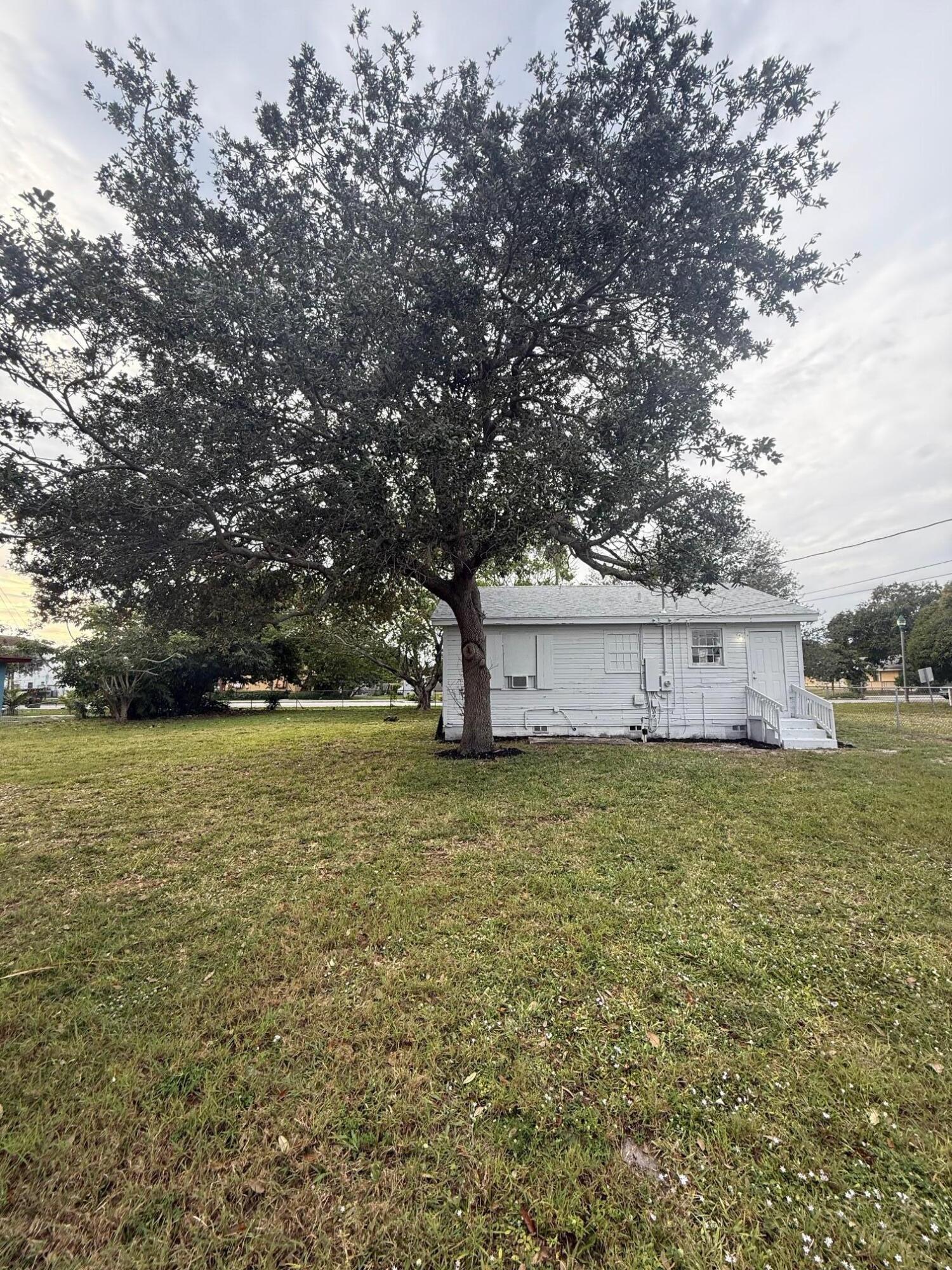 33 Southwest 12th Avenue Delray Beach, FL 33444 - Photo 4 of 17 a view of a tree next to a yard