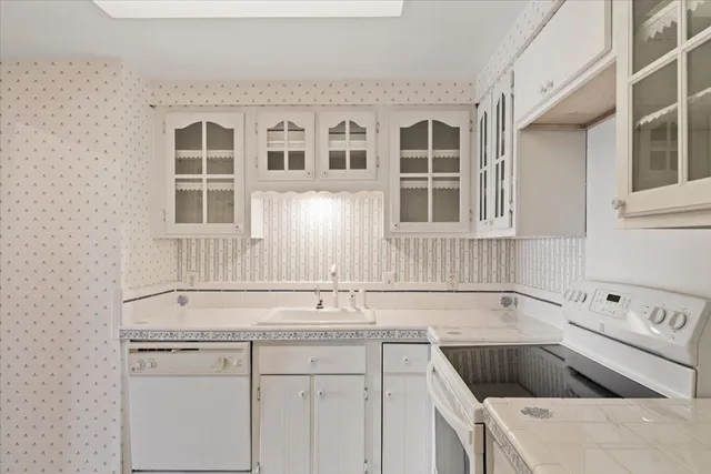 a kitchen that has a sink and a stove