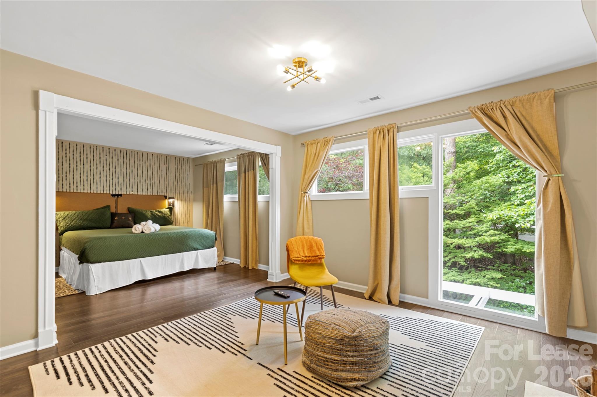 a bedroom with furniture and a window