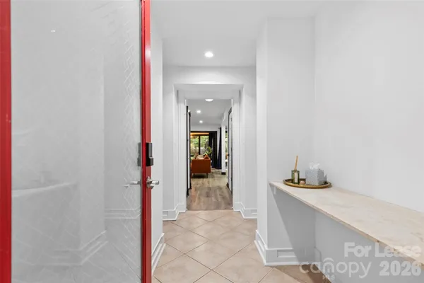 a view of a bathroom from the hallway