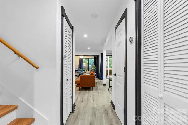 a view of a hallway with couch and furniture