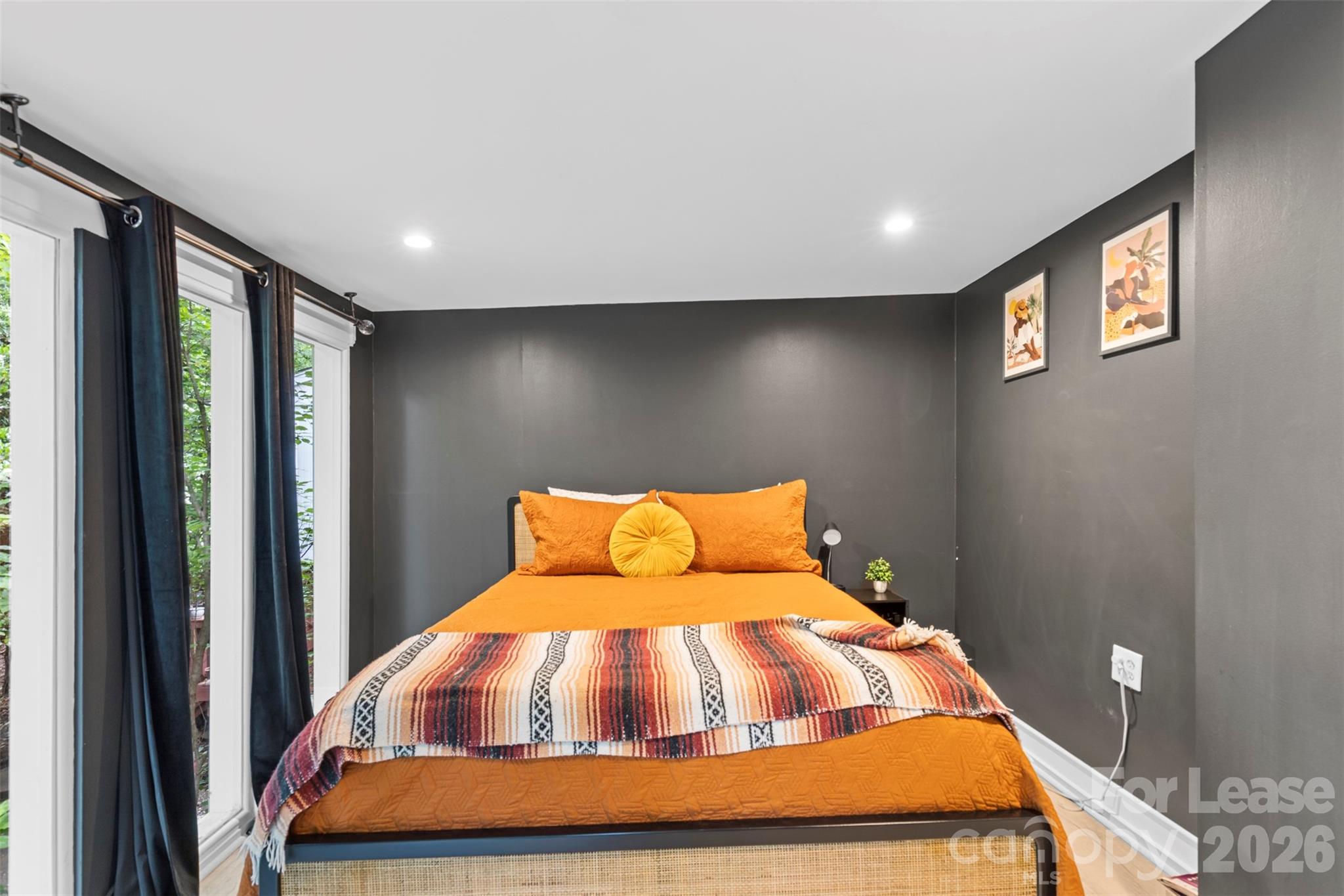 25033 Molokai Drive, Unit UPPR Tega Cay, SC 29708 - Photo 19 of 38 a bedroom with a bed and glass door