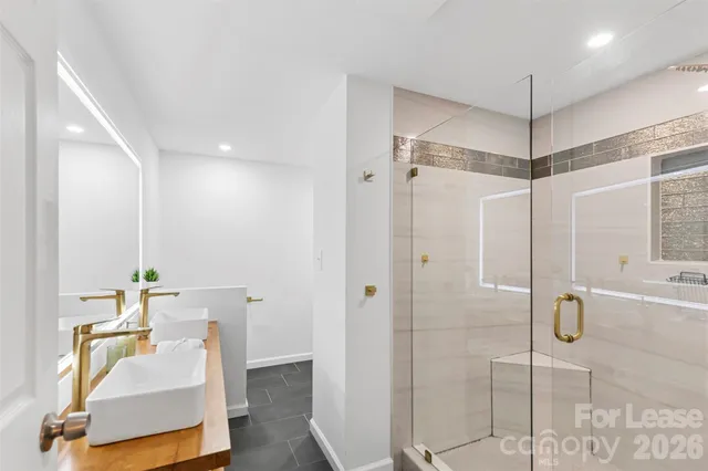 a bathroom with a sink and mirror