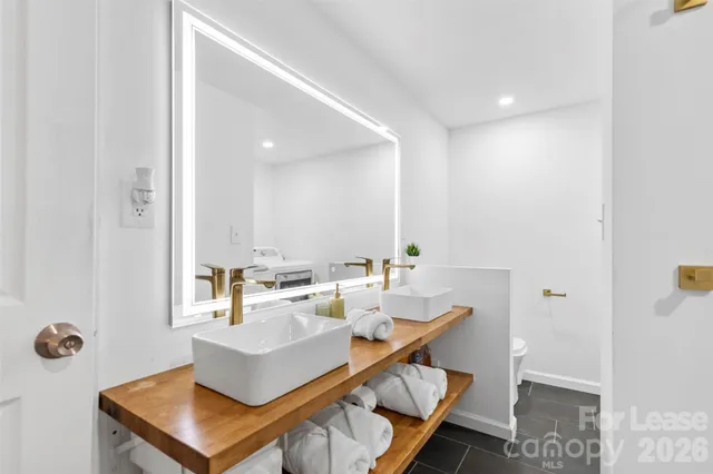 a workspace with furniture and bathroom