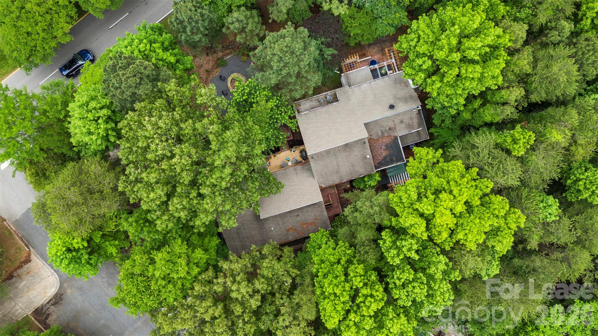 25033 Molokai Drive, Unit UPPR Tega Cay, SC 29708 - Photo 32 of 38 an aerial view of a house with a yard and garden