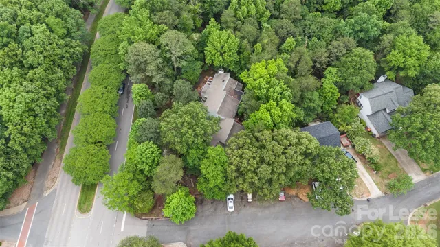 an aerial view of a city and trees
