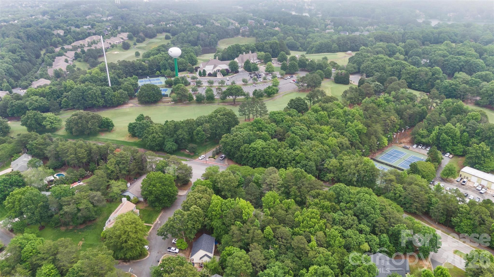25033 Molokai Drive, Unit UPPR Tega Cay, SC 29708 - Photo 38 of 38 an aerial view of residential houses with outdoor space and trees