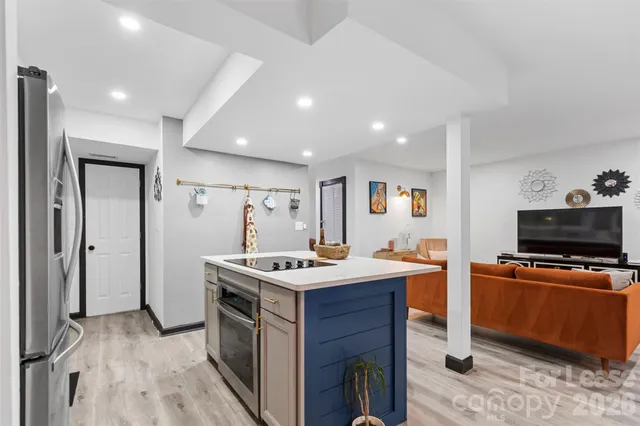 a kitchen that has a stove and a table