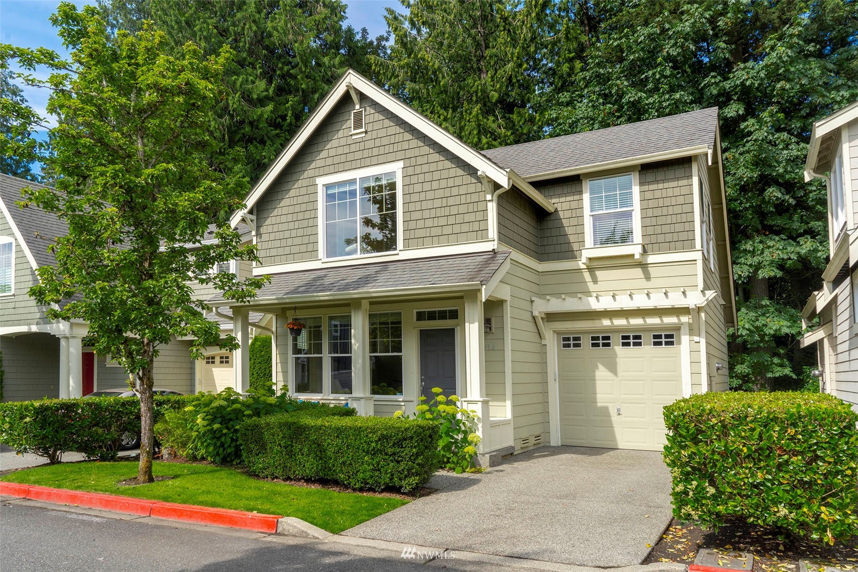 23914 33rd Drive Southeast Bothell, WA 98021 - Photo 1 of 28 a front view of a house with garden