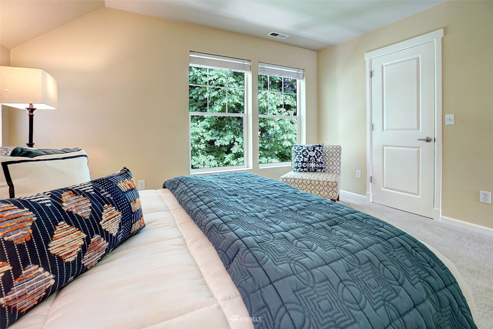 23914 33rd Drive Southeast Bothell, WA 98021 - Photo 13 of 28 a bed sitting in a bedroom next to a window