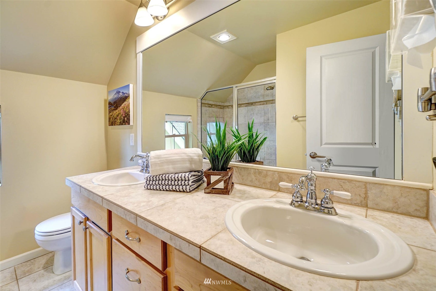 23914 33rd Drive Southeast Bothell, WA 98021 - Photo 15 of 28 a bathroom with a granite countertop sink a toilet and a mirror