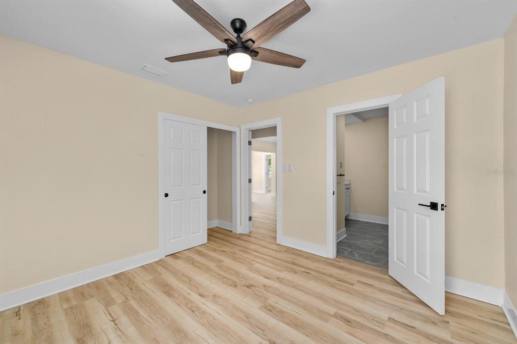 10707 North Rome Avenue Tampa, FL 33612 - Photo 14 of 35 wooden floor in an empty room