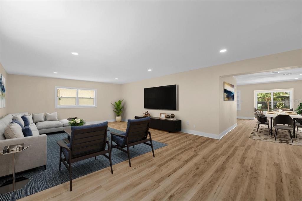 10707 North Rome Avenue Tampa, FL 33612 - Photo 18 of 35 a living room with furniture a flat screen tv and a fireplace