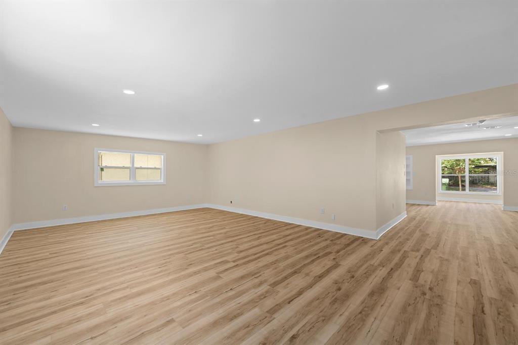 10707 North Rome Avenue Tampa, FL 33612 - Photo 19 of 35 a view of empty room with wooden floor and fan