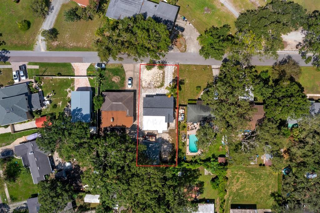 10707 North Rome Avenue Tampa, FL 33612 - Photo 2 of 35 an aerial view of a house with a yard