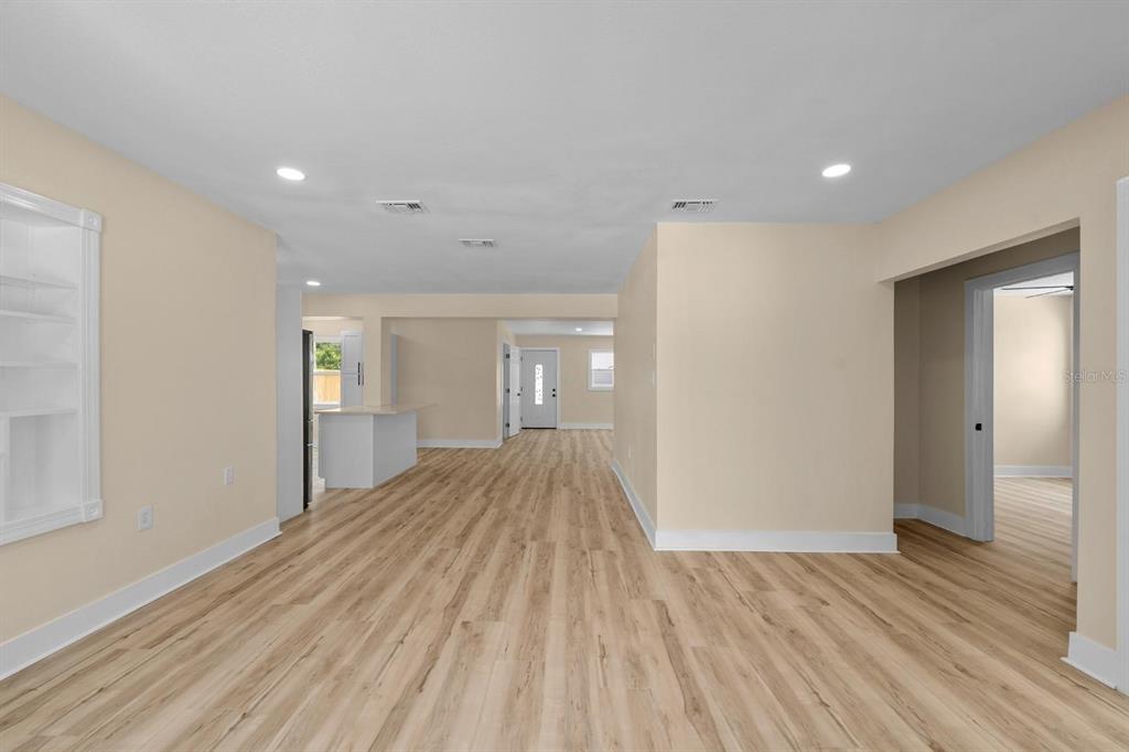 10707 North Rome Avenue Tampa, FL 33612 - Photo 25 of 35 a view of hallway with wooden floor
