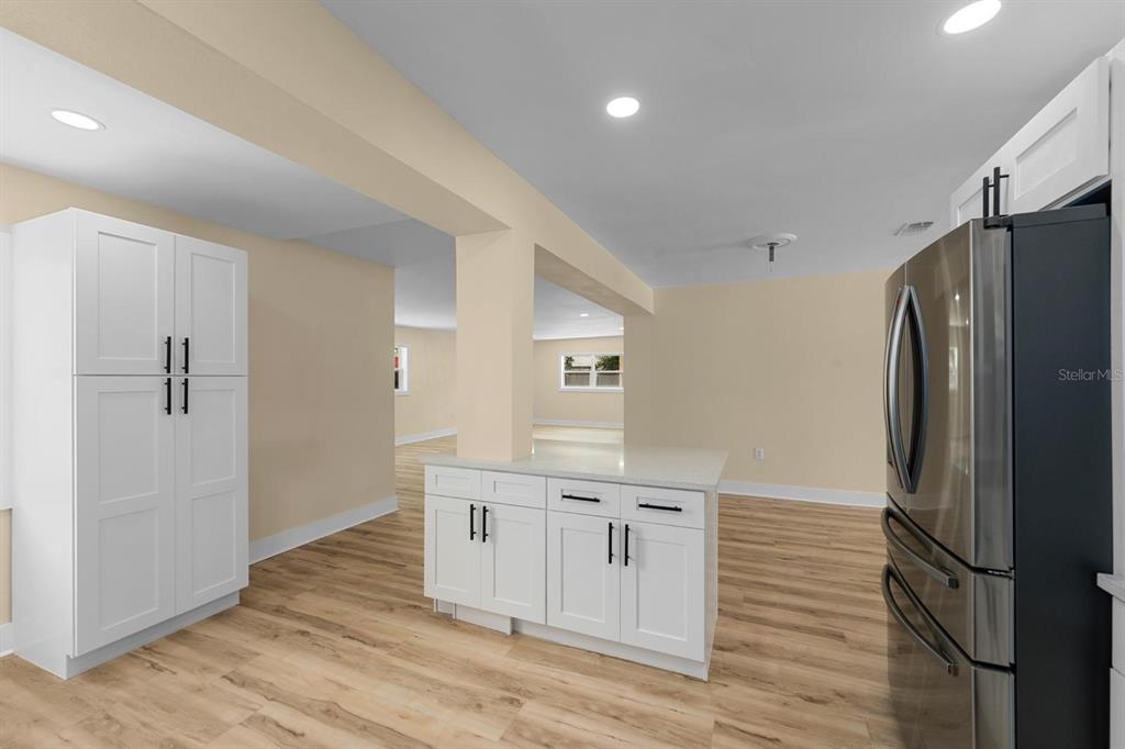 10707 North Rome Avenue Tampa, FL 33612 - Photo 29 of 35 a kitchen with a refrigerator and a sink