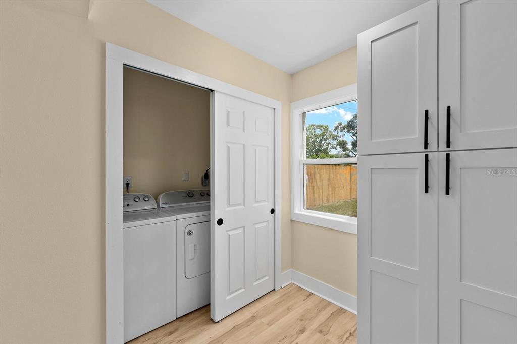 10707 North Rome Avenue Tampa, FL 33612 - Photo 30 of 35 a view of bathroom with a sink mirror and window